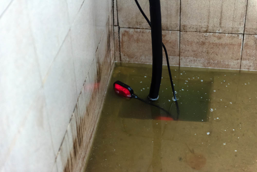 sump pump in a dirty water pool