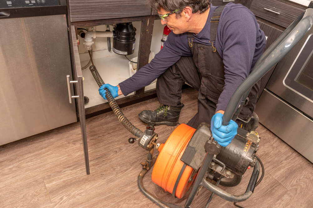 expert drain cleaning tools side-by-side with