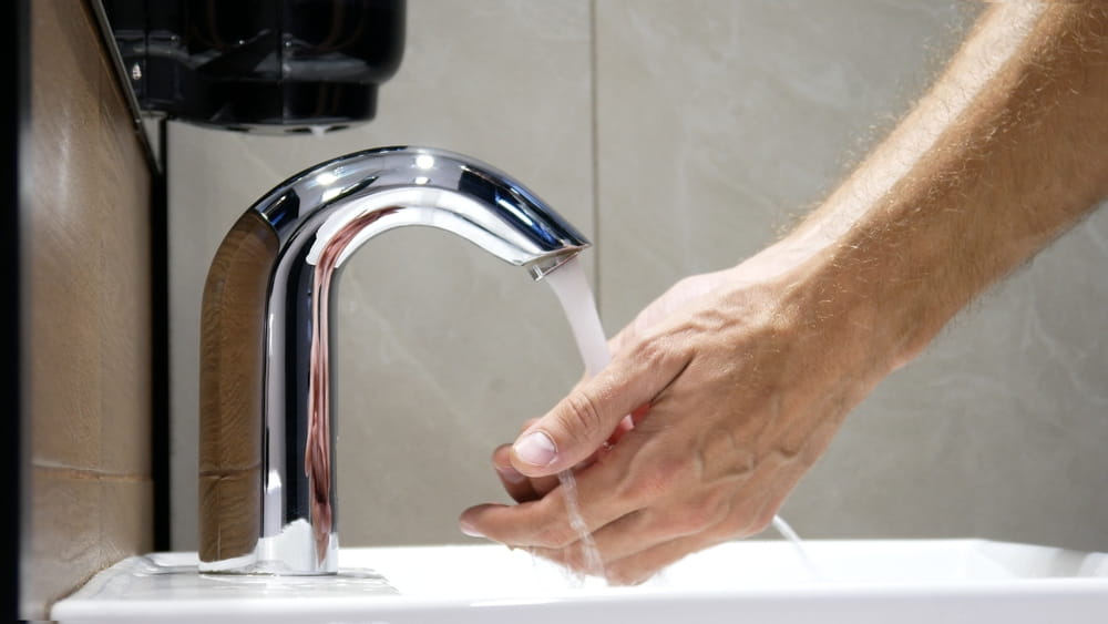 man washing his hands